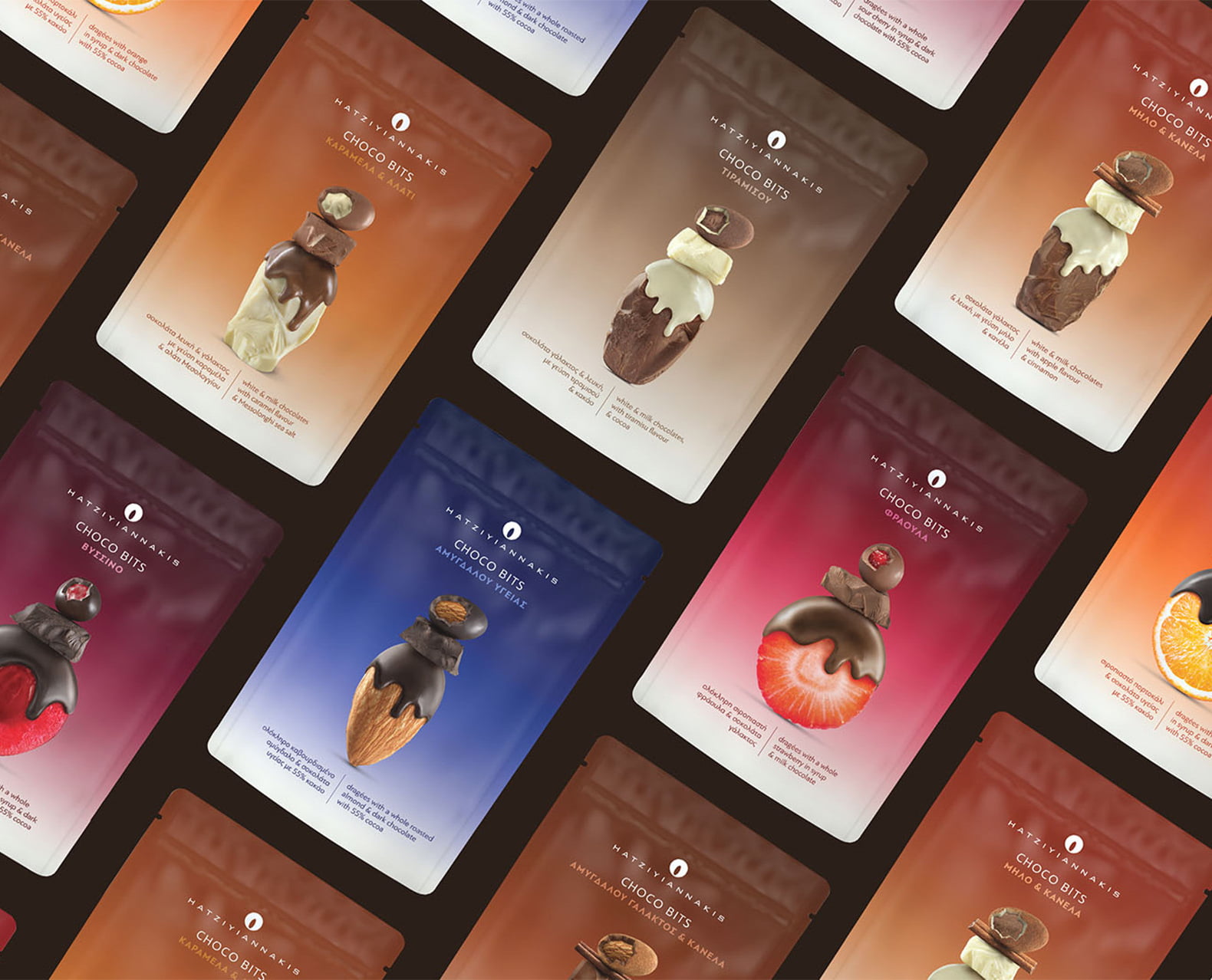 A dense flat lay pattern of Hatziyiannakis Choco Bits stand-up pouches, showcasing the full range of fruit and specialty flavors, each with a stylized chocolate-covered ingredient graphic.
