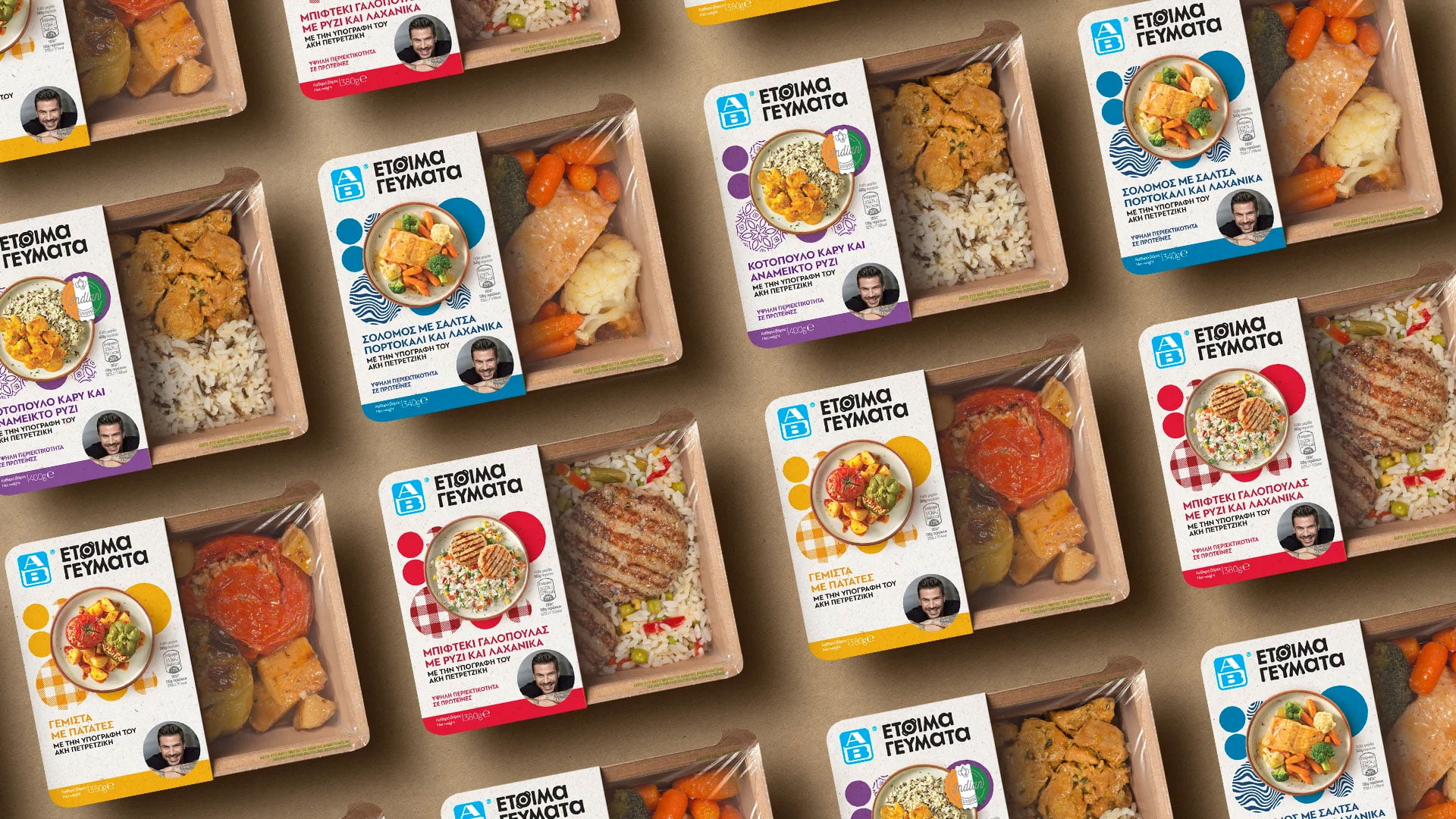 A flat lay pattern showing the full product line of AB Ready Meals by Akis Petretzikis, with various colorful packaging sleeves for different meals like salmon, gemista, and curry chicken.