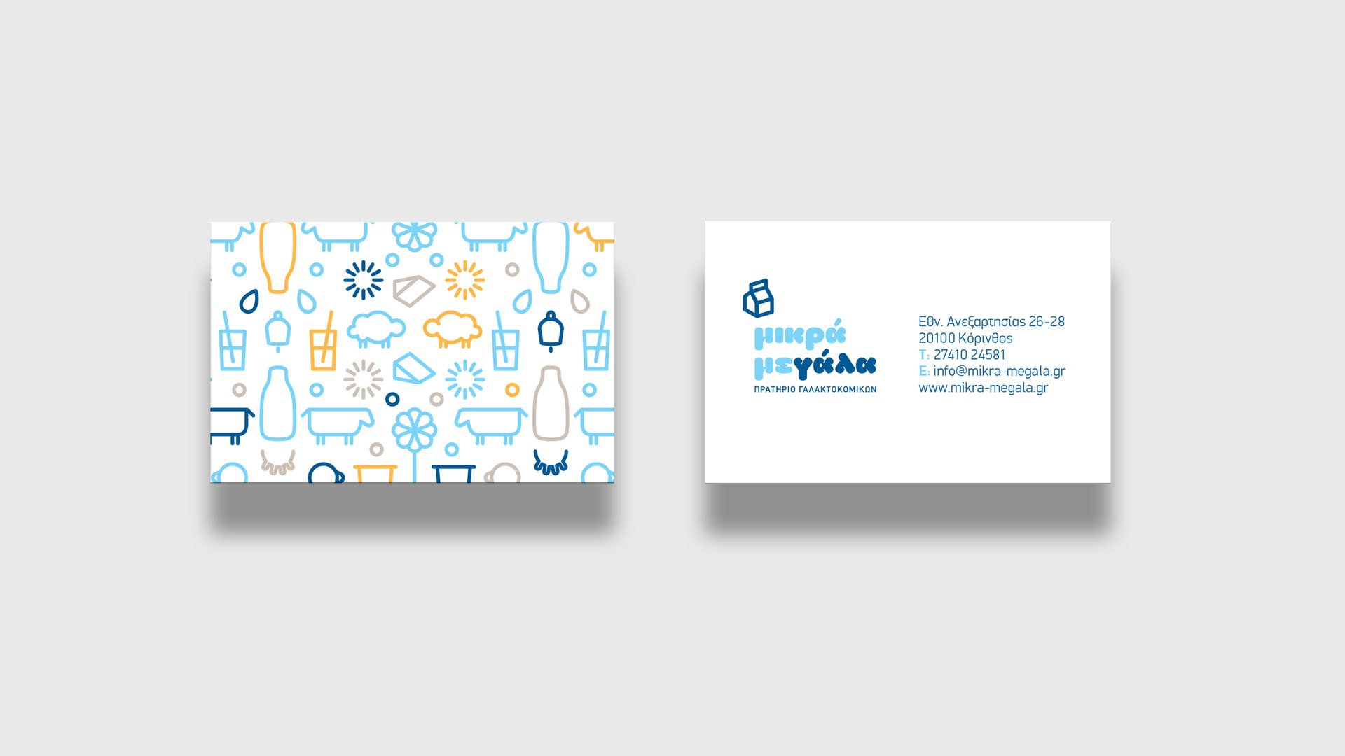 Front and back side of Mikra Megala business card with logo and custom illustrations