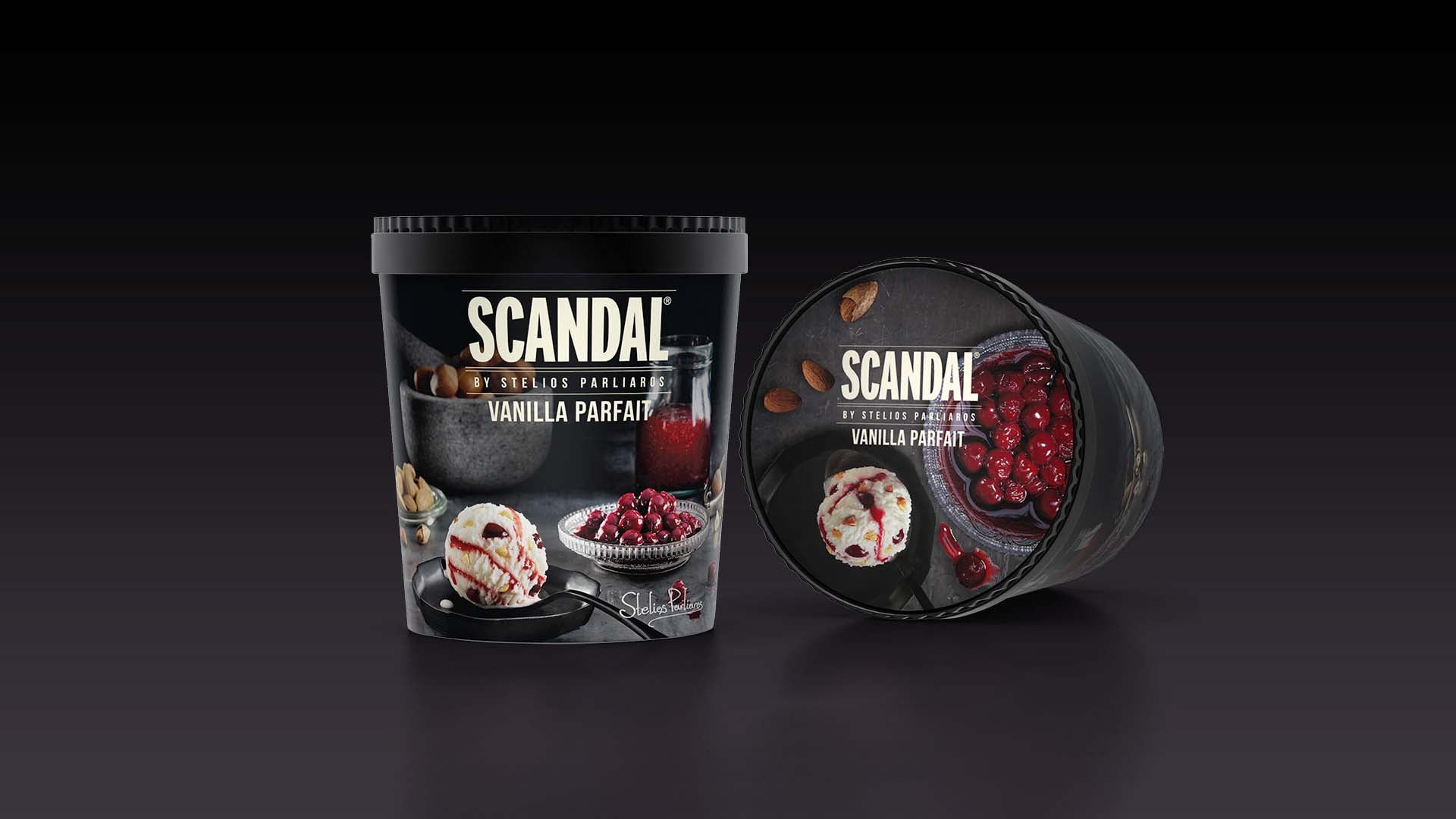 A product shot of Scandal by Stelios Parliaros 'Vanilla Parfait' ice cream, showing the black tub standing upright and lying on its side, revealing the lid, all on a dark reflective background.